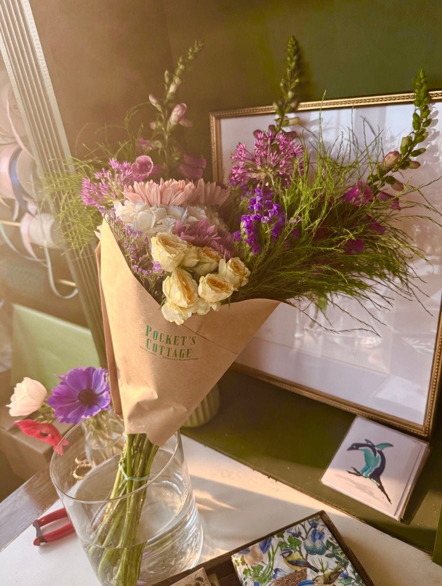 Large hand-tied bouquet of farm-fresh seasonal blooms wrapped in sustainable craft paper with a silk ribbon — Pocket's Cottage Red Hook NY
